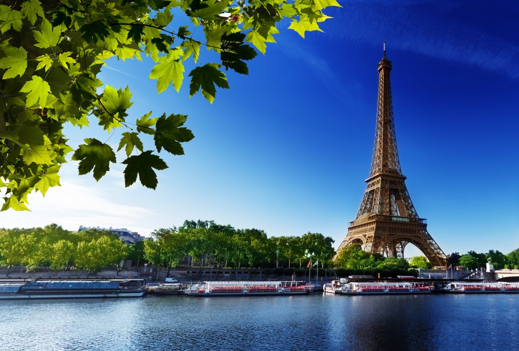 Seine River in Paris with Eiffel Tower on a sunny day.